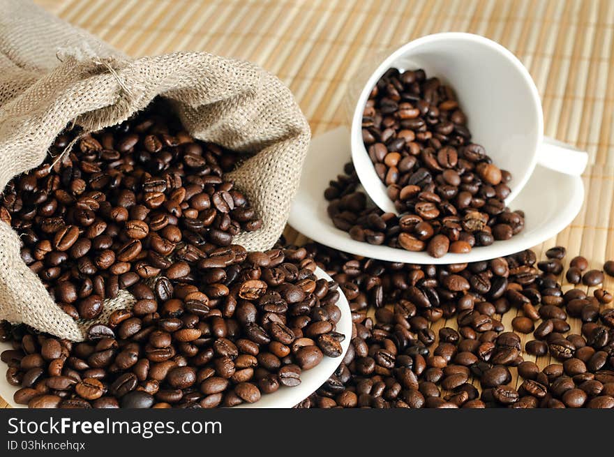 Coffee Beans With A White Cup And Sack