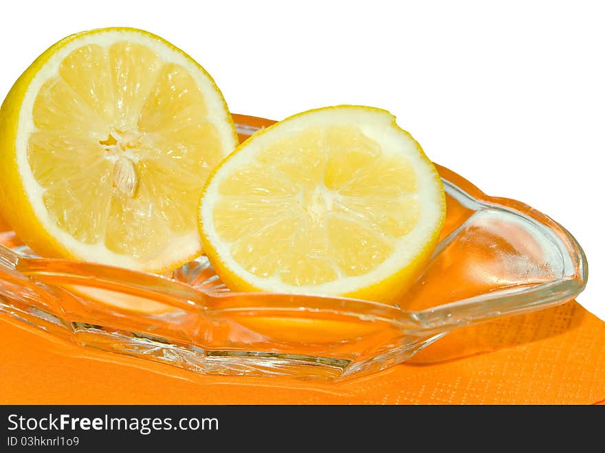 Two lemons on a plate, white background. Two lemons on a plate, white background