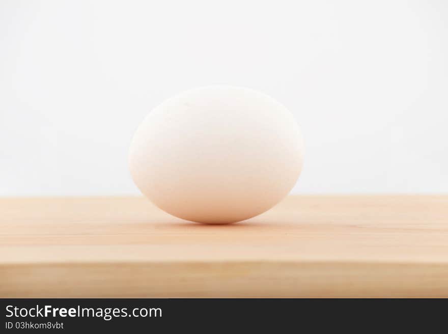 An egg on the chopping board