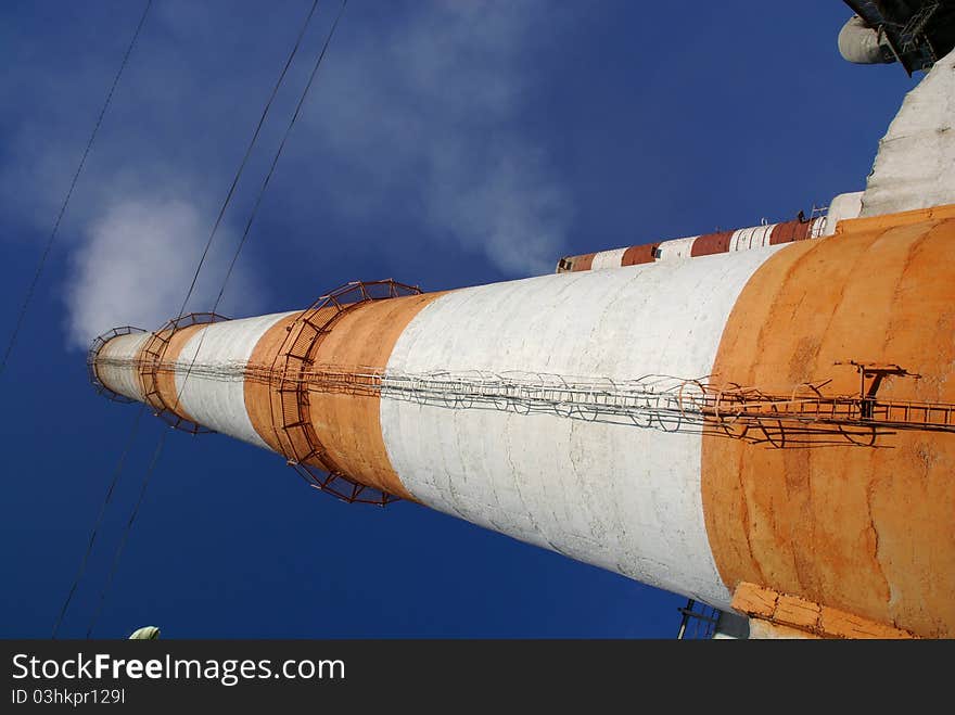 Two of the most high exhaust pipes at a cement plant. Western Russia. Two of the most high exhaust pipes at a cement plant. Western Russia