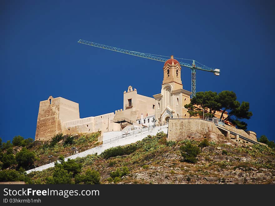 View of castle construction and religious architecture in Cullera, Valencia, Spain. View of castle construction and religious architecture in Cullera, Valencia, Spain