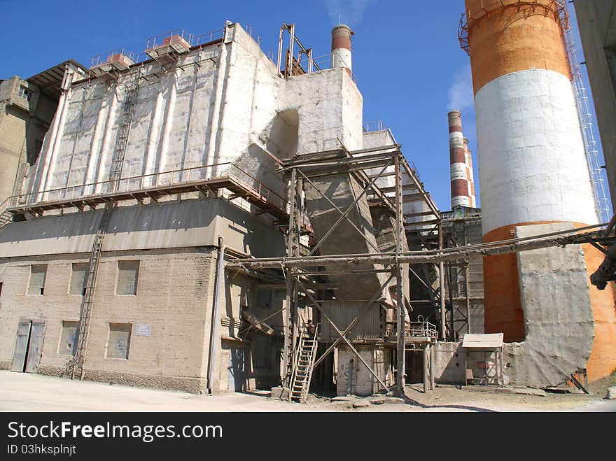 High brick chimneys at a cement plant. Western Russia. High brick chimneys at a cement plant. Western Russia