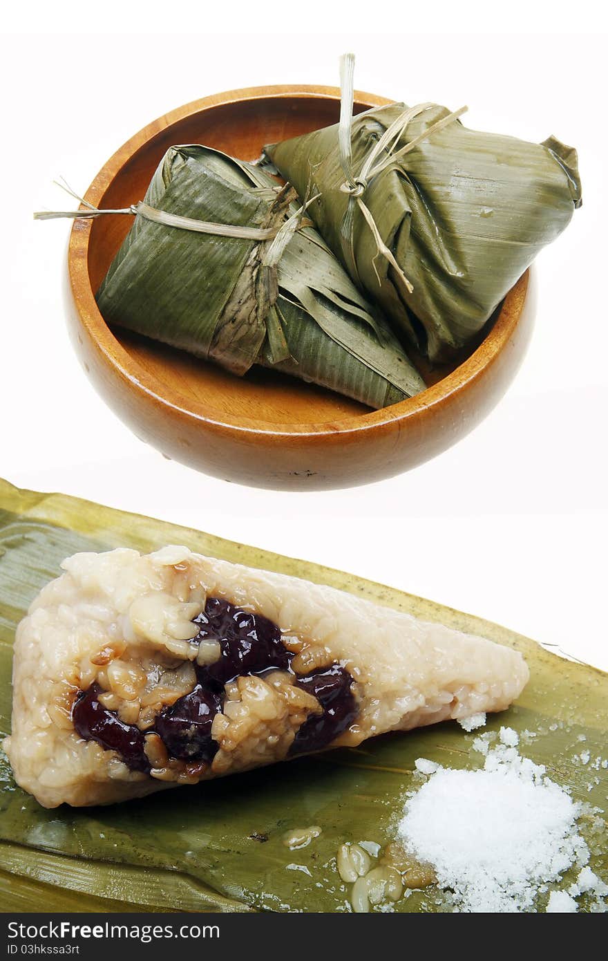 Chinese traditional food -- Rice dumpling. Chinese traditional Zongzi includes glutinous rice and red jujube. With white sugar together edible.