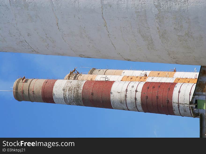 Four of the most high exhaust pipes at a cement plant. Western Russia. Four of the most high exhaust pipes at a cement plant. Western Russia