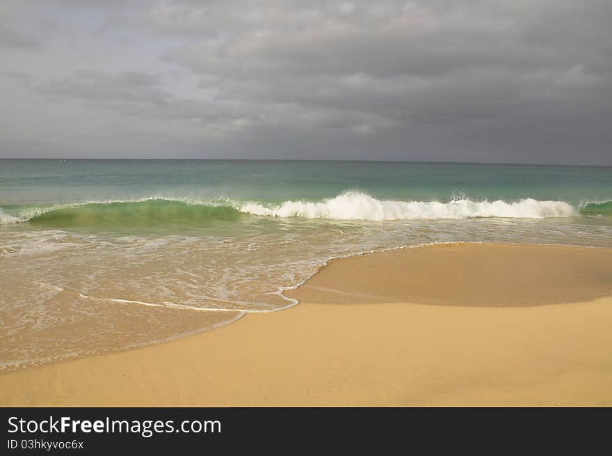 Waves crash onto paradise beach