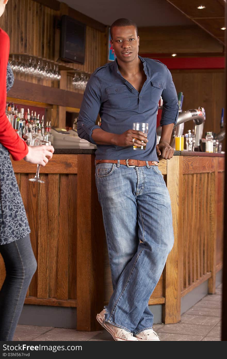 Handsome man in bar looking at camera