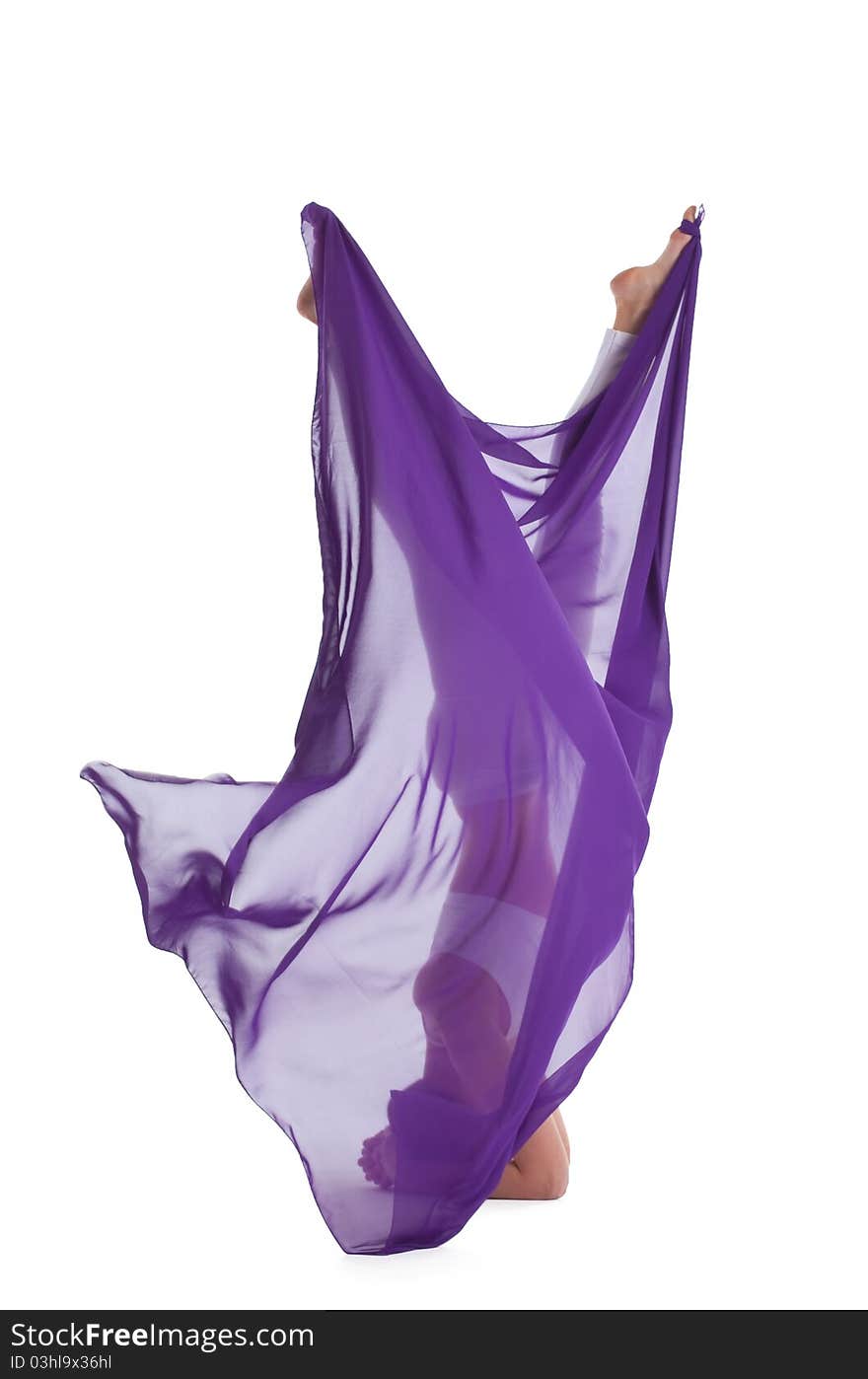 Woman with flying purple cloth walking in the air