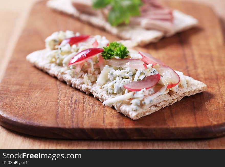 Crispbread with blue cheese and pate - closeup