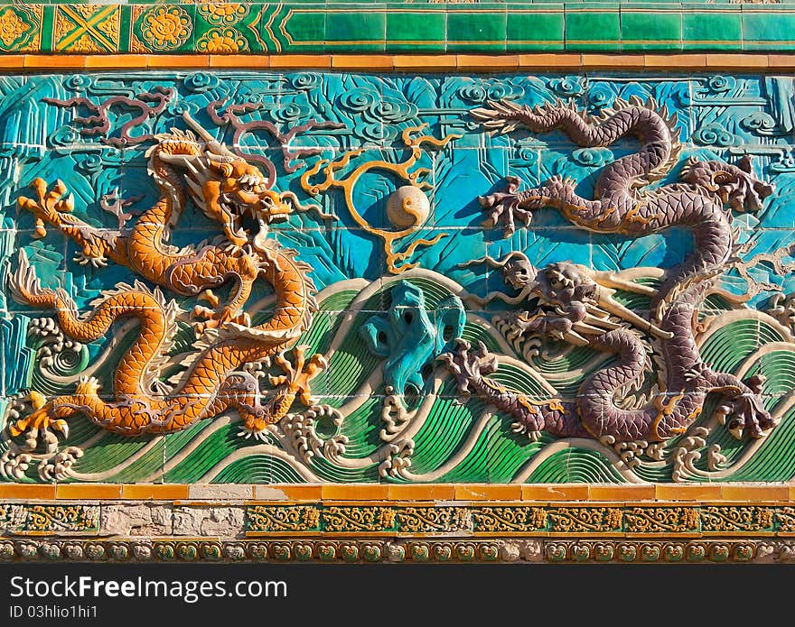 Built in 1756, the Nine-Dragon Screen is about 27 meters (about 88.6 feet) long, 6.65 meters (about 21.8 feet) high and 1.42 meters (4.66 feet) thick. It is composed of 424 seven-color glazed tiles that embossing the screen. Built in 1756, the Nine-Dragon Screen is about 27 meters (about 88.6 feet) long, 6.65 meters (about 21.8 feet) high and 1.42 meters (4.66 feet) thick. It is composed of 424 seven-color glazed tiles that embossing the screen.