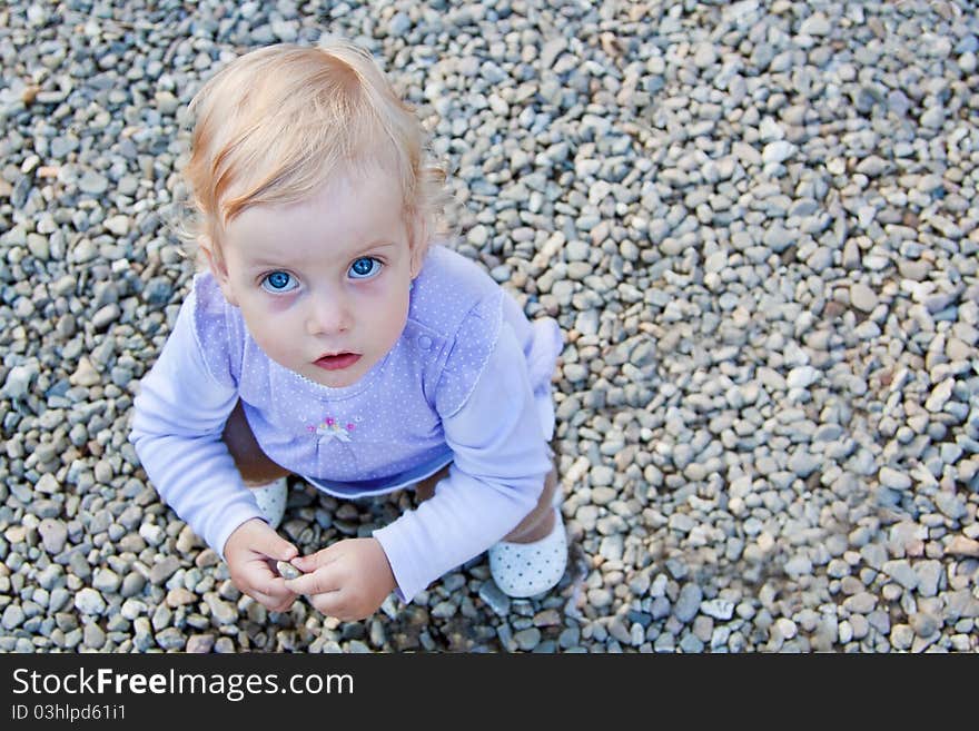 Baby Playing With Stones