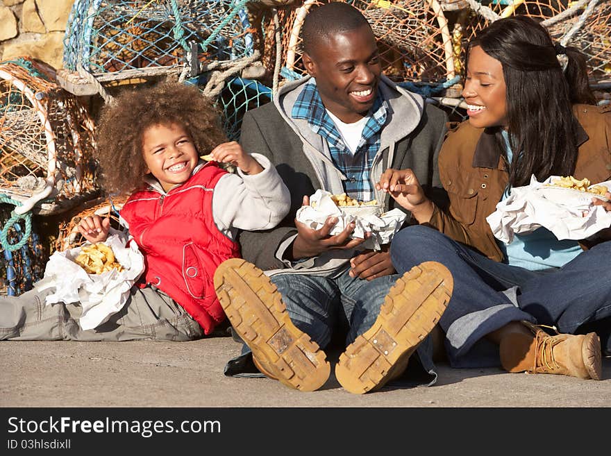 Happy family having picnic smiling