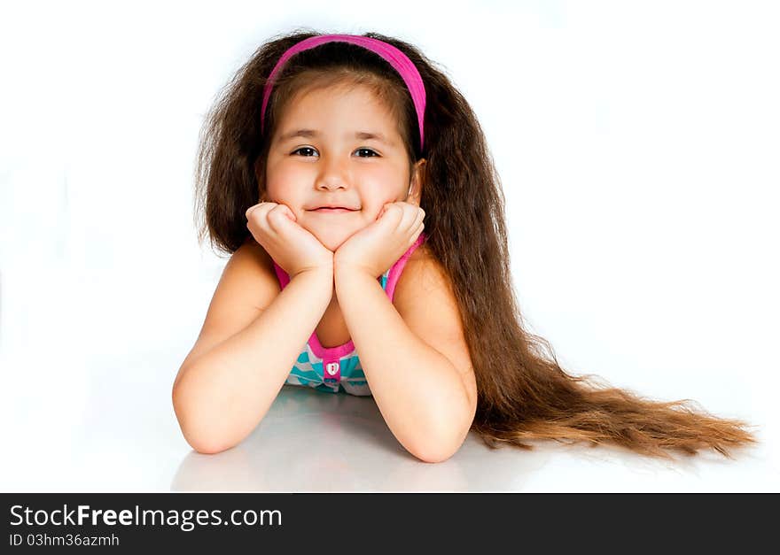 Beautiful little girl isolated on a white background