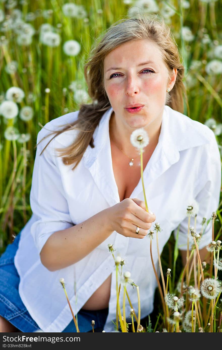 Woman outdoor with dandelion