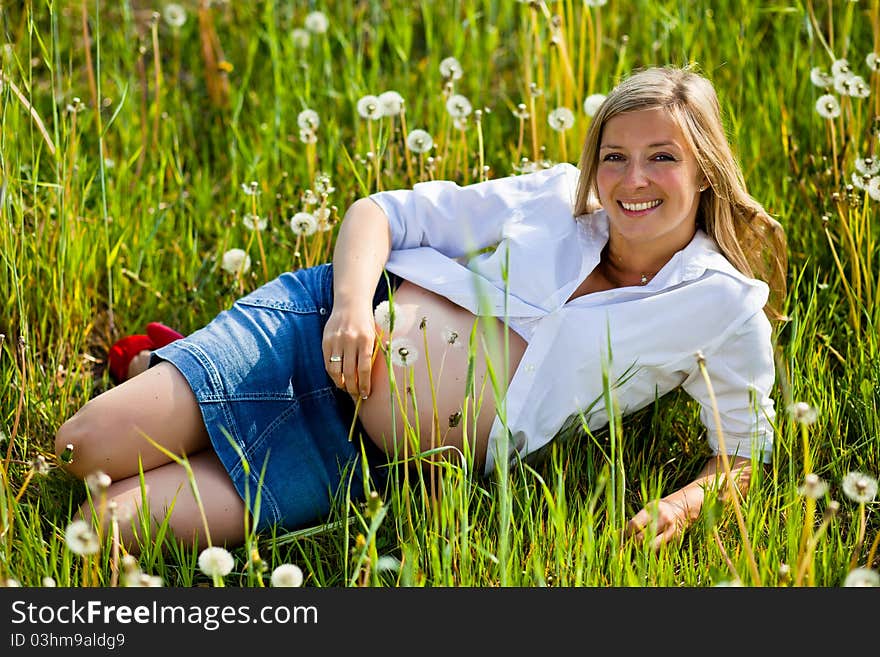 Woman outdoor with dandelion