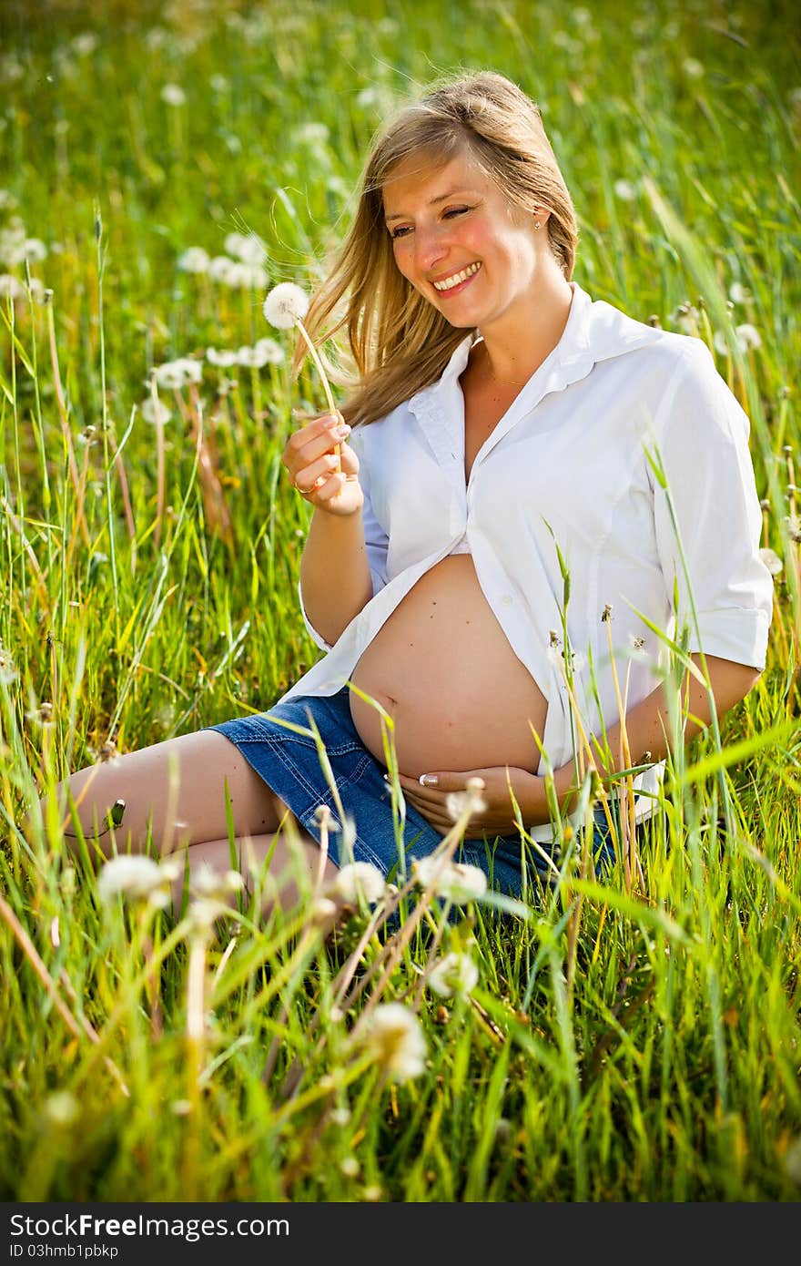 Woman outdoor with dandelion