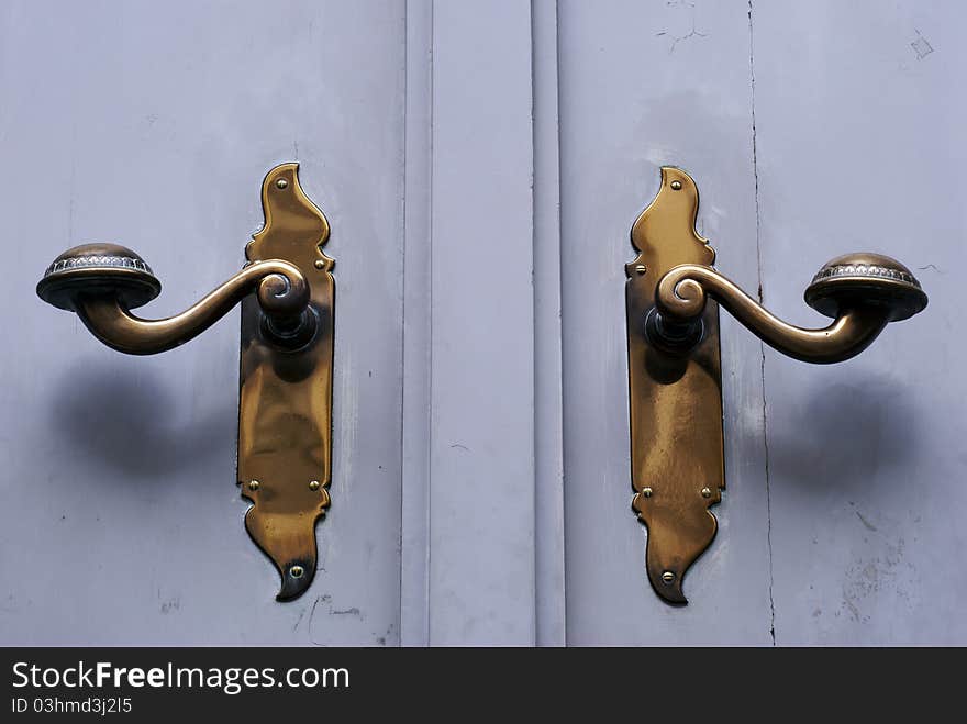 Two door handles on doors in German town Lübeck.