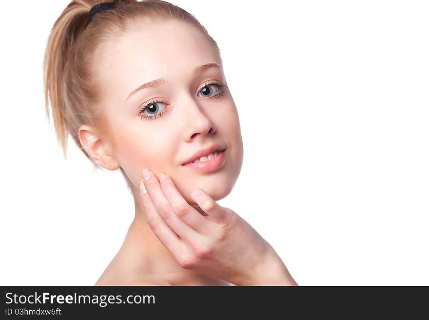 Beautiful blonde girl holding hands near the face, shot on a white background. Beautiful blonde girl holding hands near the face, shot on a white background