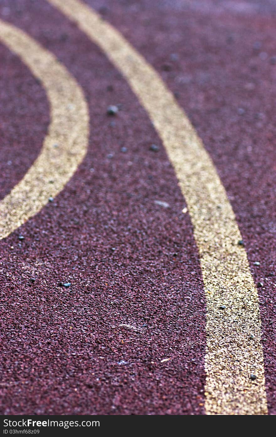 Rubber surface of sports ground. Red background.