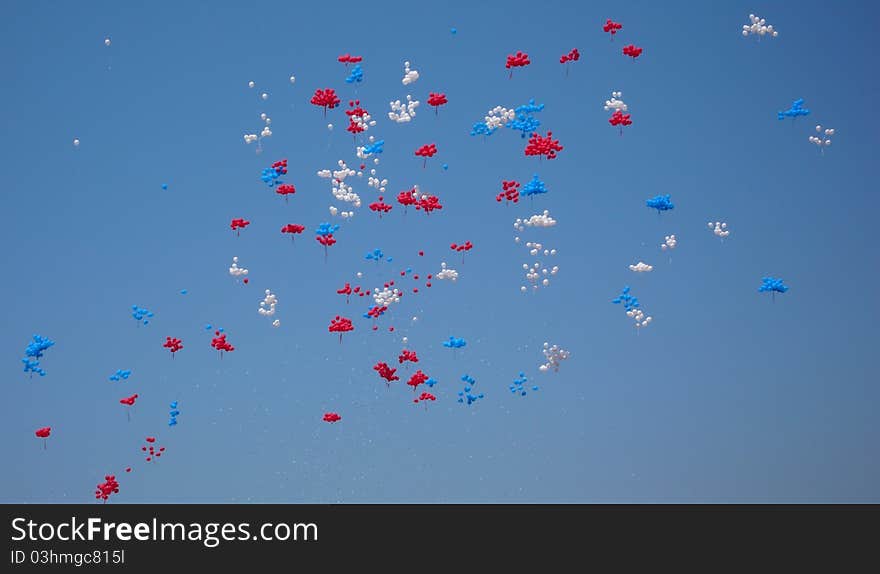 Lots of colorful balloons in the blue sky