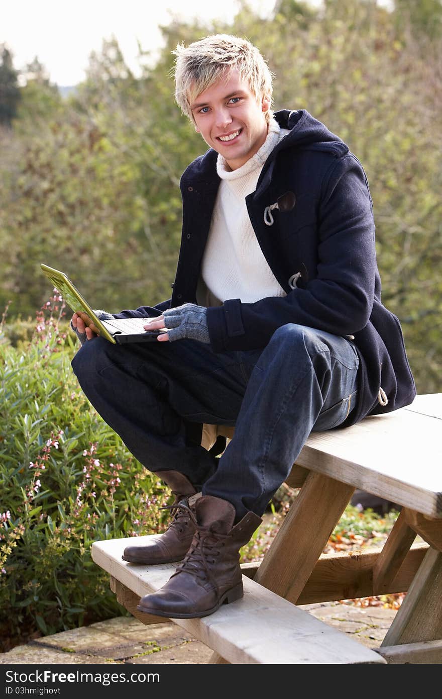 Young man with laptop computer