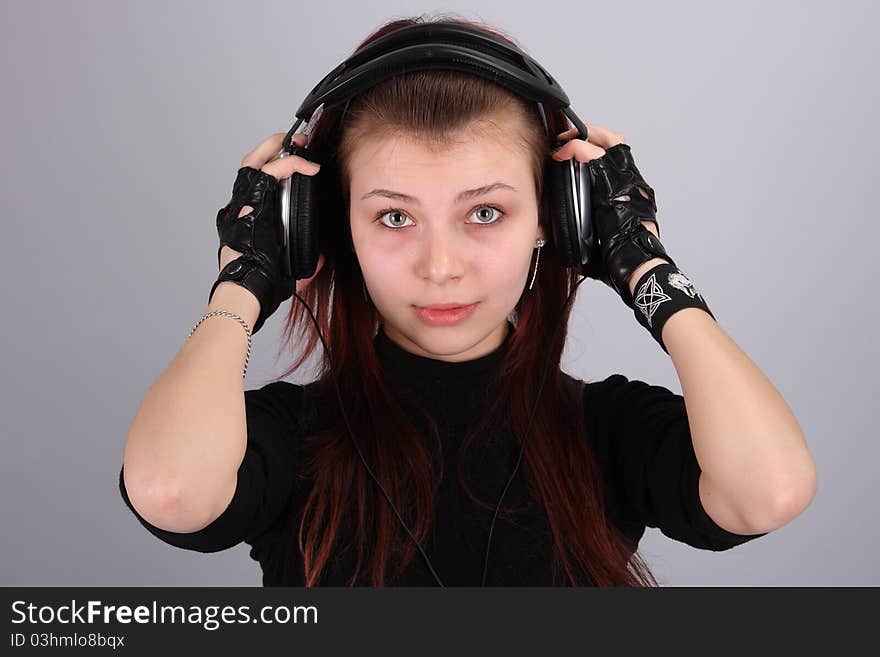 Portrait Of The Young Girl With Ear-phones