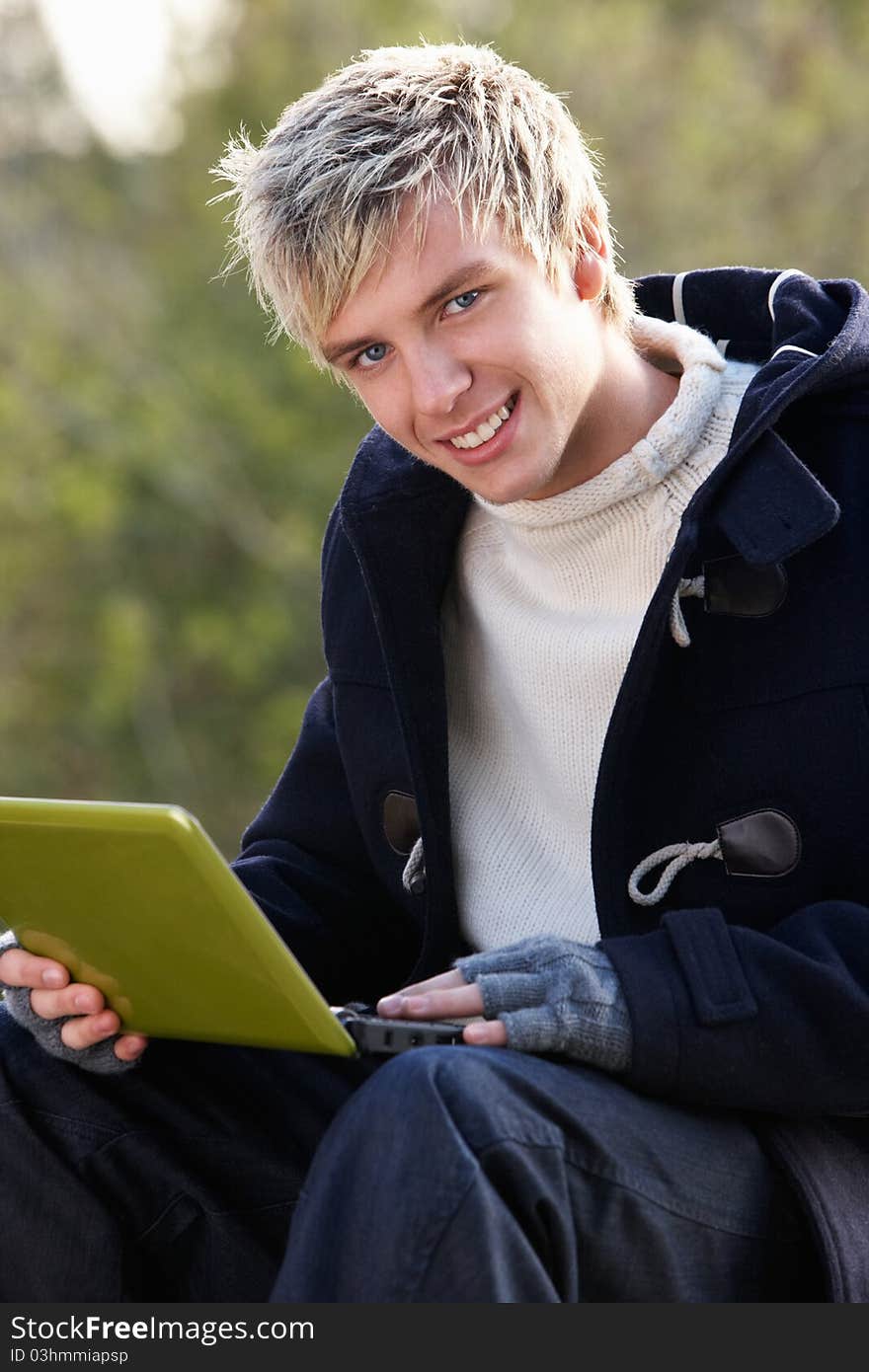 Young Man With Laptop Computer