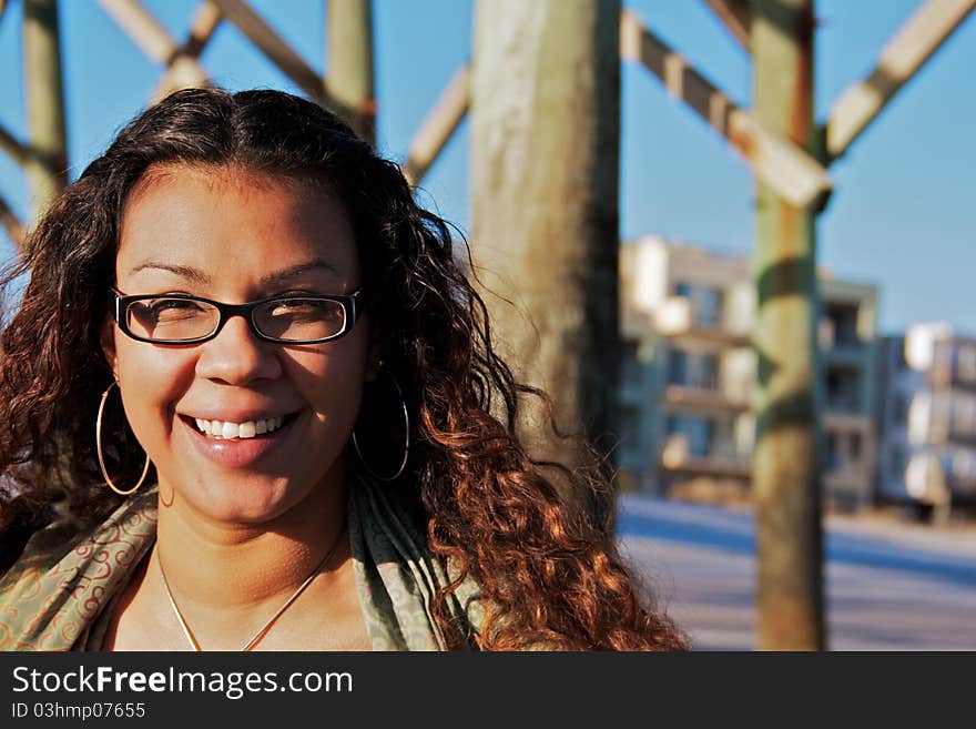 A women staring off into the ocean on a windy winter day. A women staring off into the ocean on a windy winter day