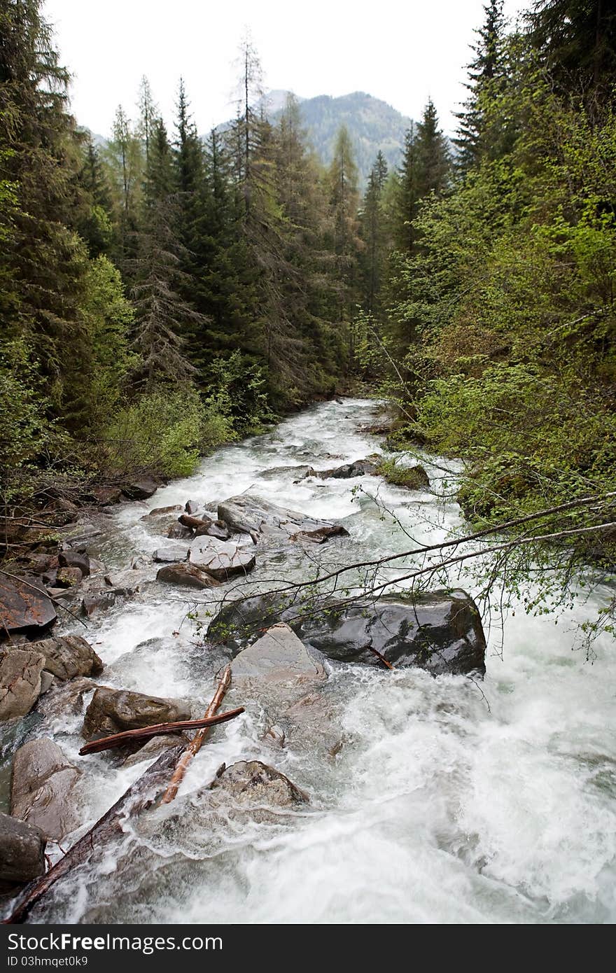 River from the melting glacier, austrian alps. River from the melting glacier, austrian alps