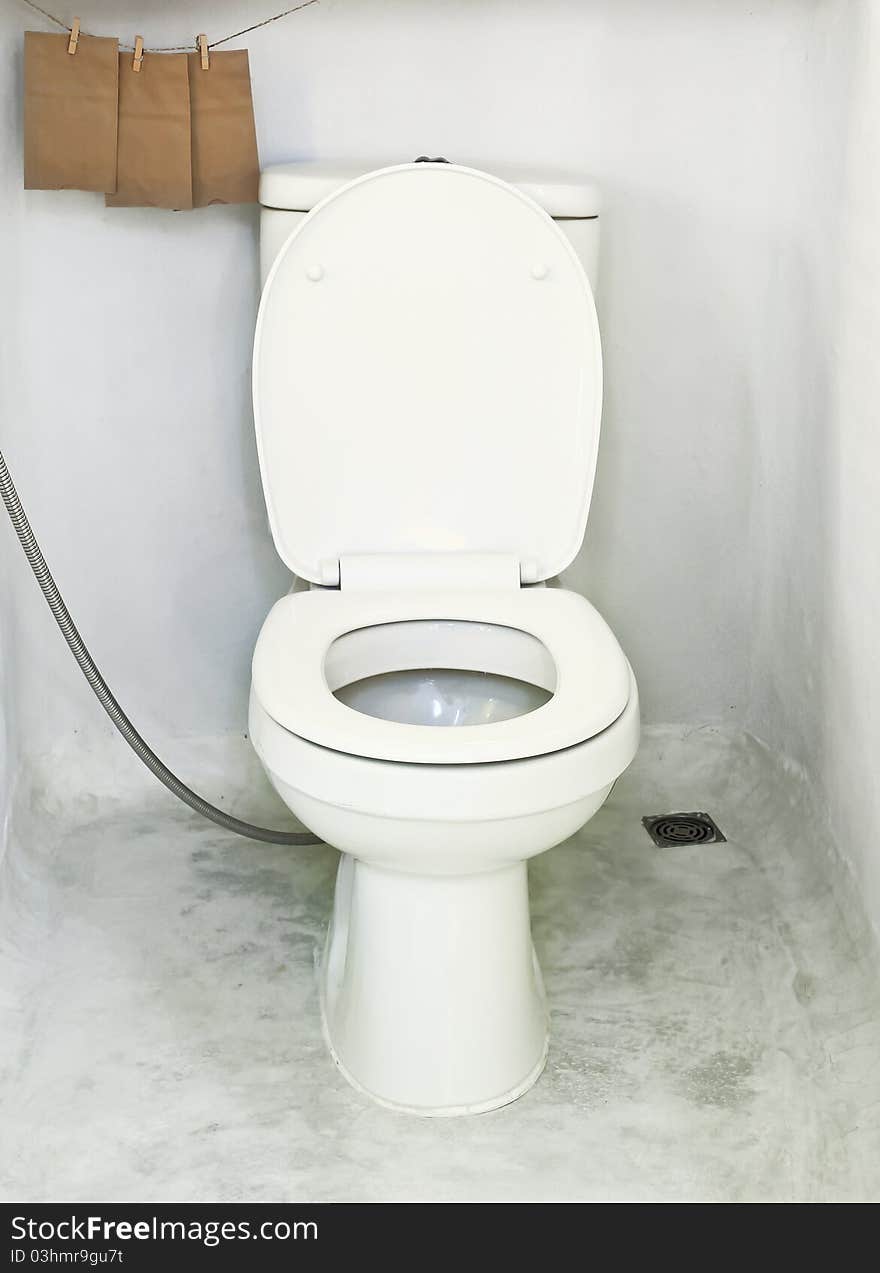 White toilet bowl in bathroom