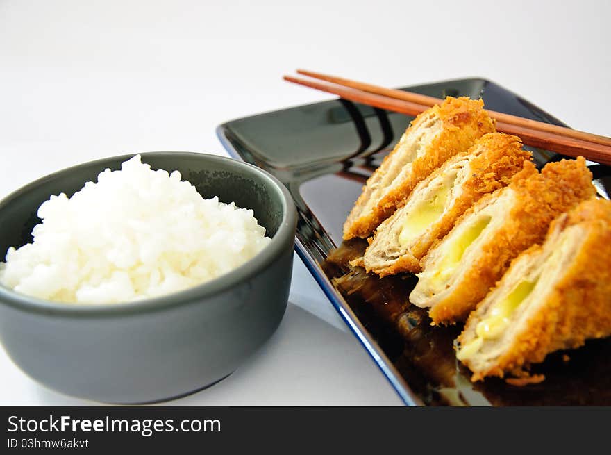 Deep fried roll pork with cheese. Serve with Japanese rice.