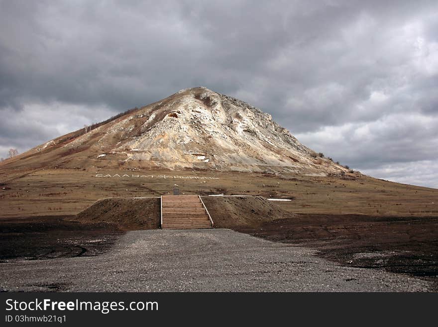 High mountain on a background of the cloudy sky in the spring