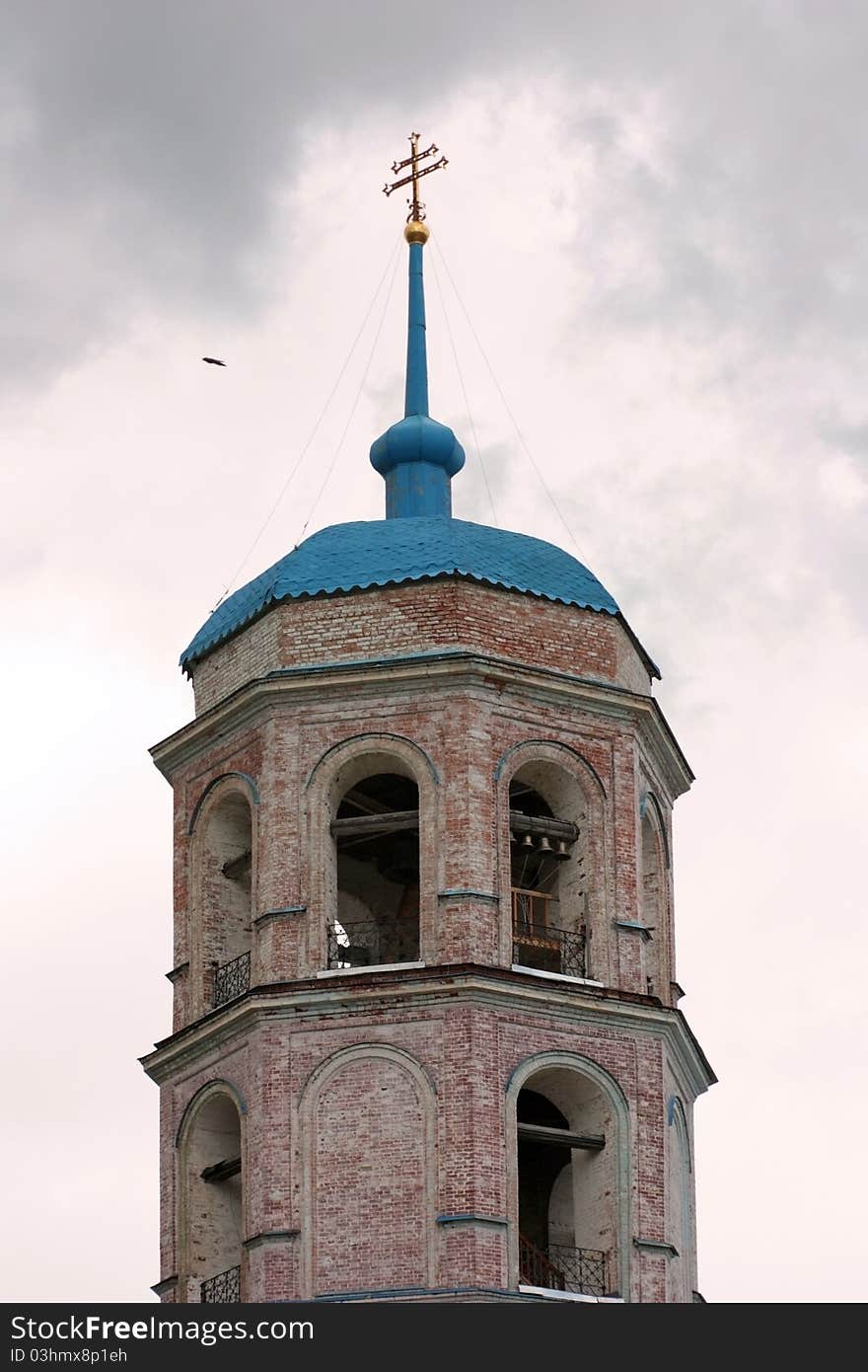 Chapel on a background of the cloudy sky