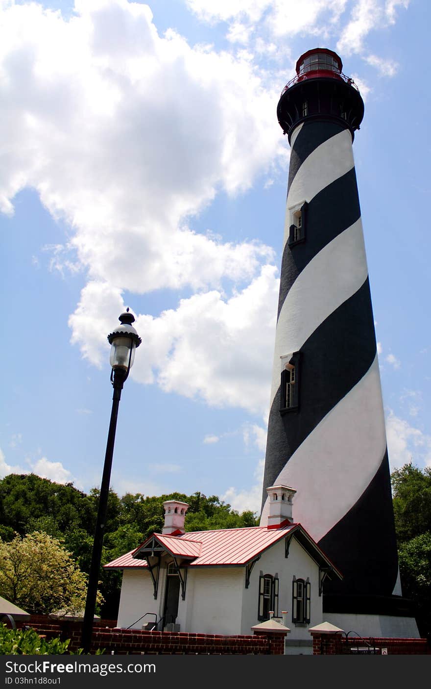 A historic lighthouse by modern street light in St Augustine Florida. A historic lighthouse by modern street light in St Augustine Florida.