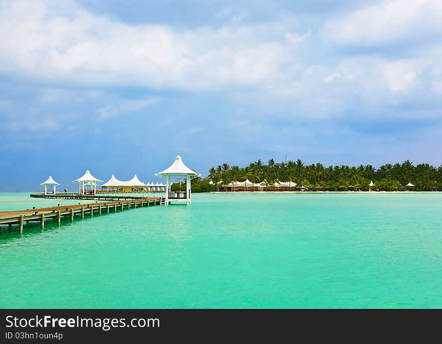 Jetty on a tropical beach at Maldives