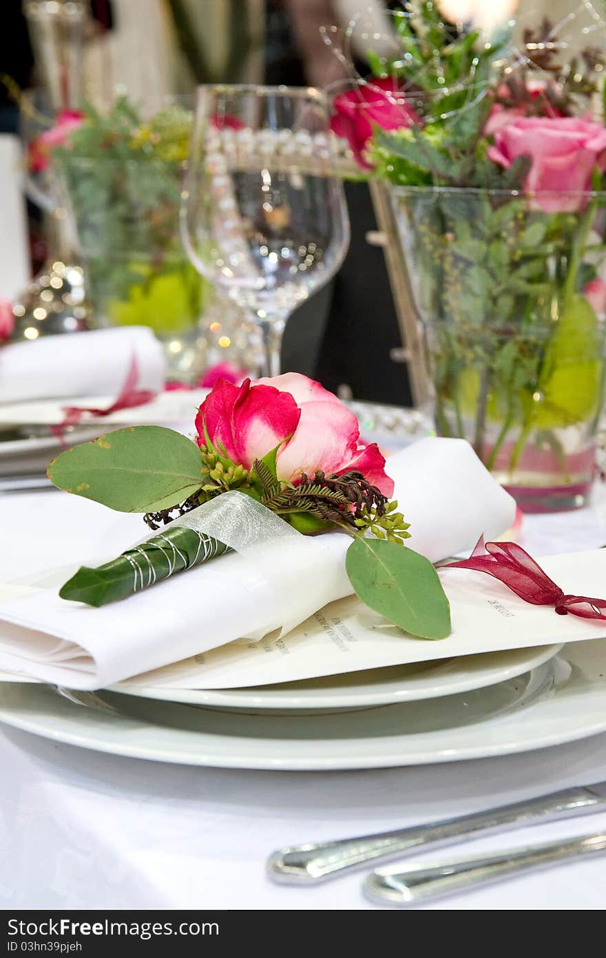 A Covered banquet with red roses decoration