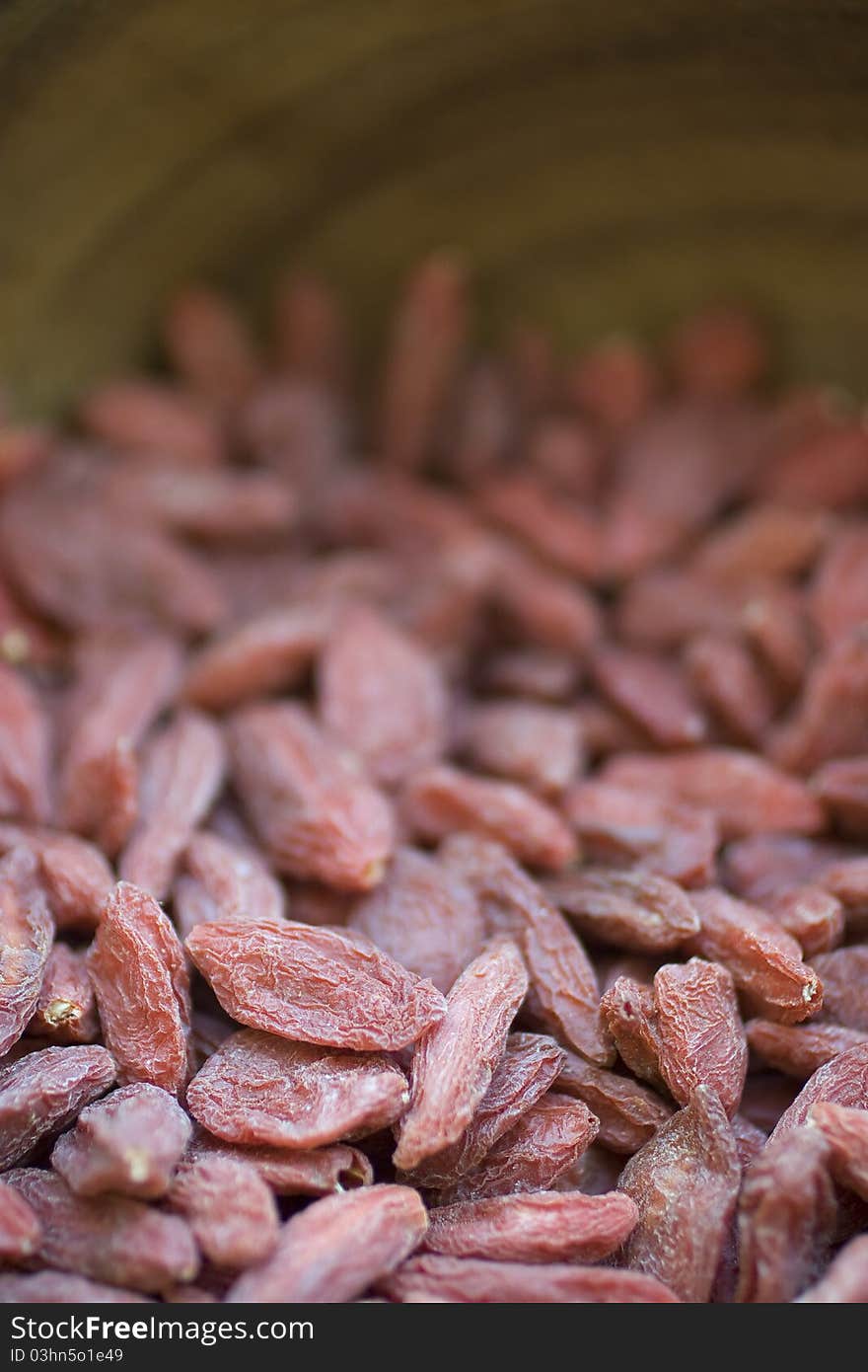 Closeup of Goji Berries in wooden bowl