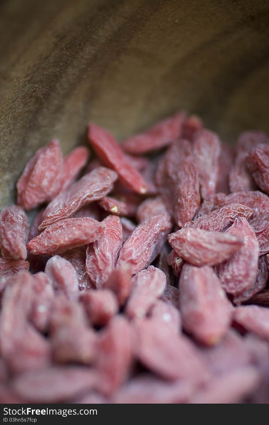 Closeup of Goji Berries in wooden bowl