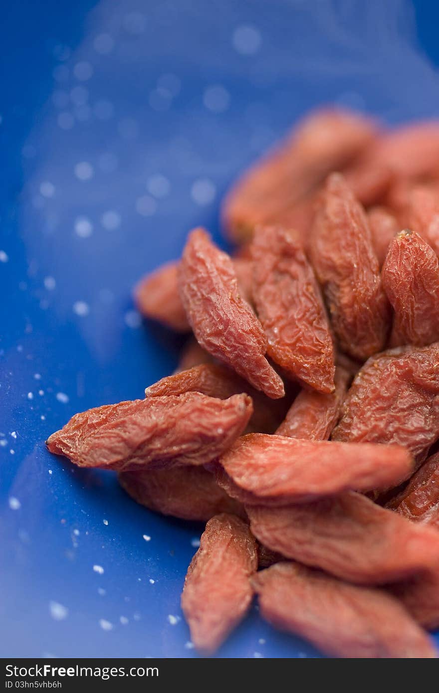 Closeup of Goji Berries in blue bowl