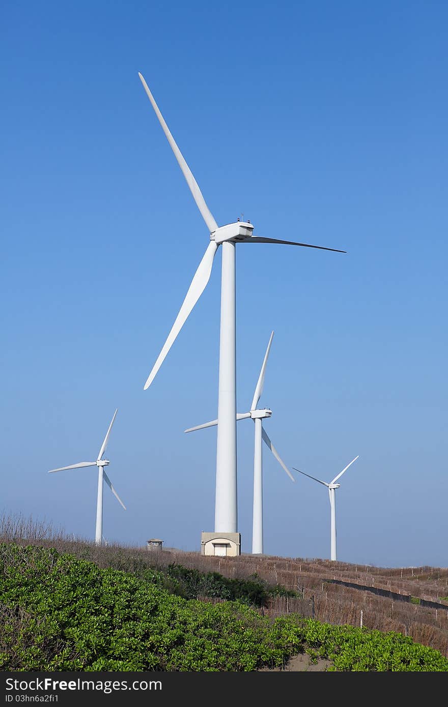 Photo of Wind power installation in sunny day