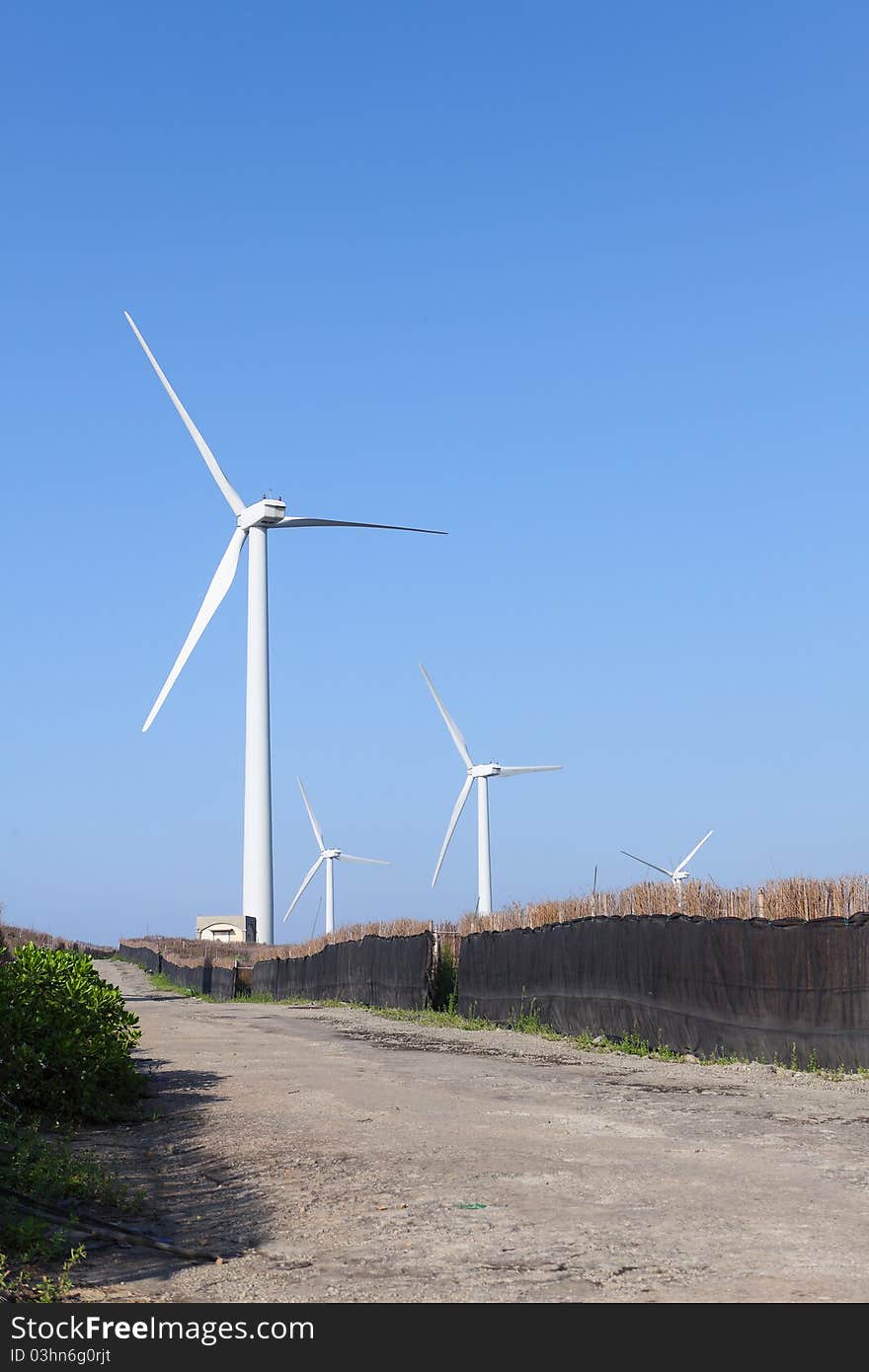 Photo of Wind power installation in sunny day