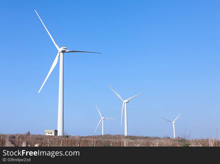 Photo of Wind power installation in sunny day