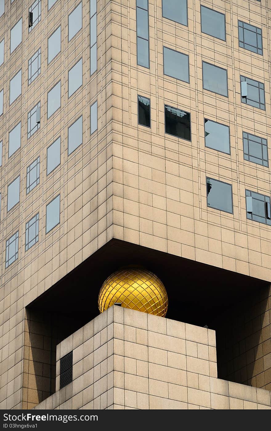 This was the exterior surface of a modern building, featured by the golden ball.