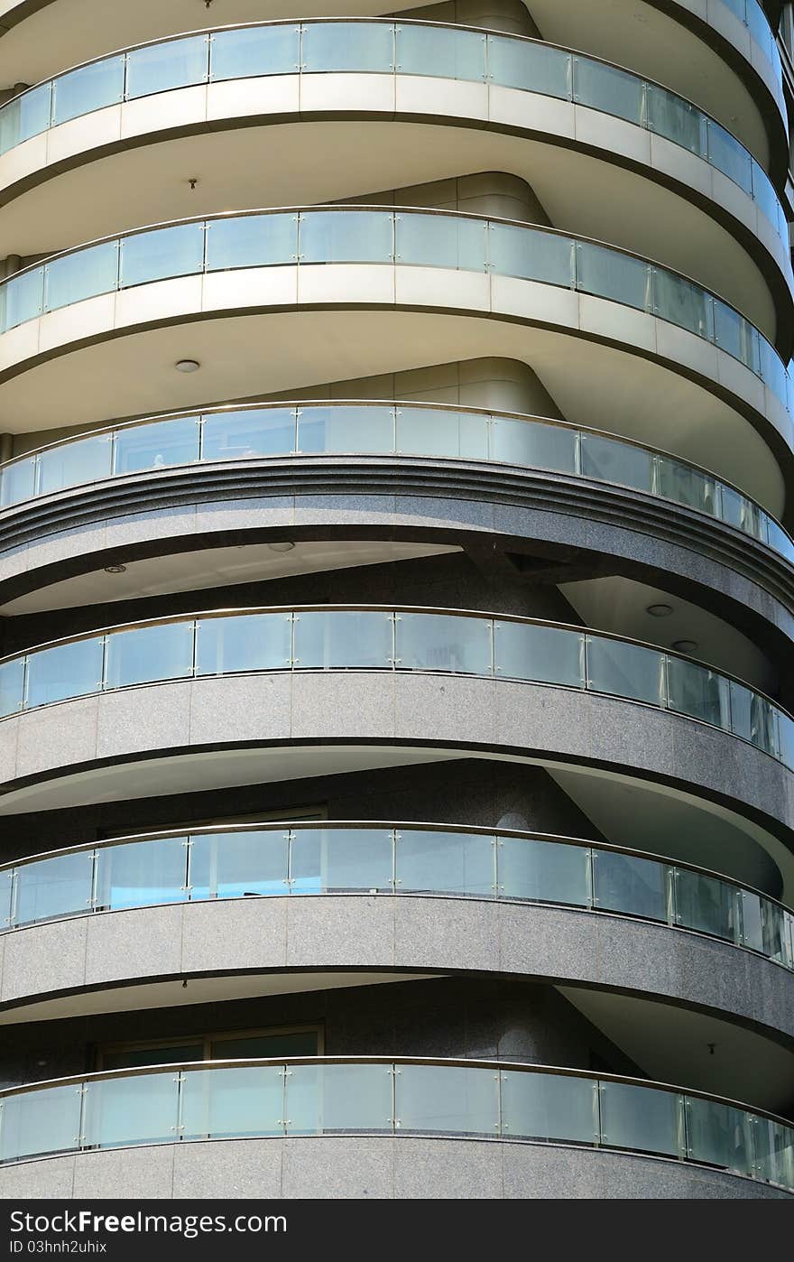 Those are balconies of a modern residential building. Those are balconies of a modern residential building.