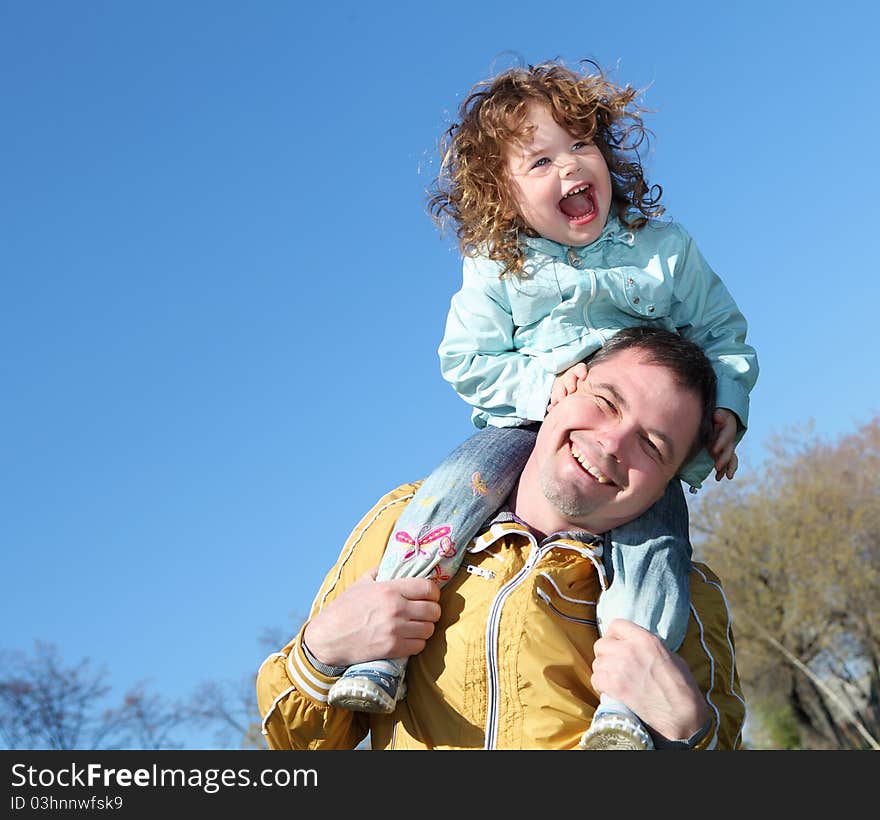 Litlle girl with father in the park