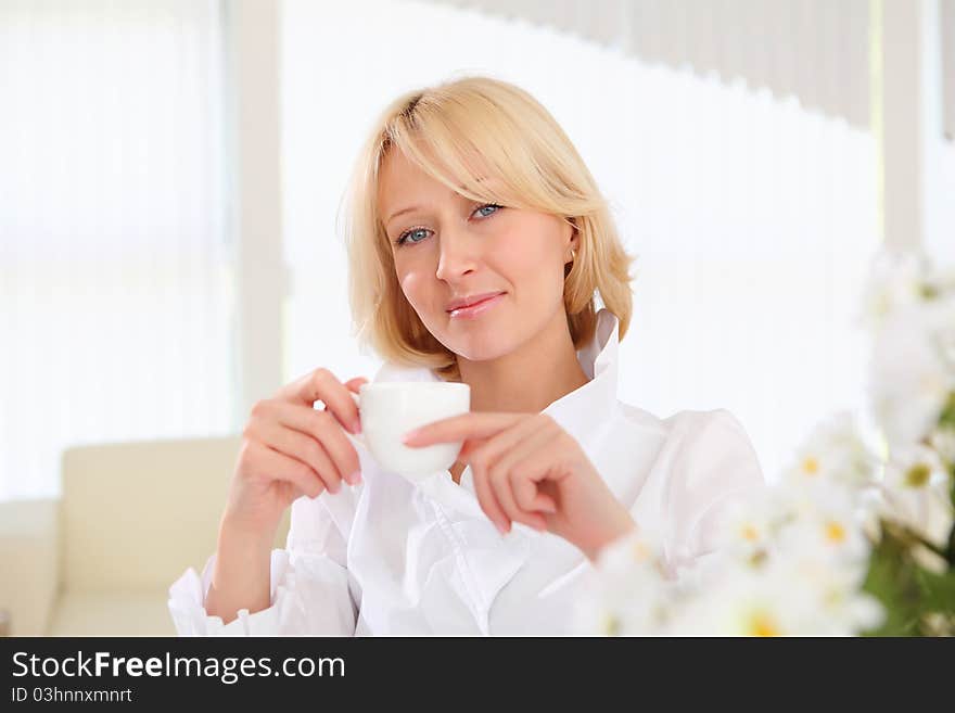 Portrait of young business lady holding a tea cup. Portrait of young business lady holding a tea cup