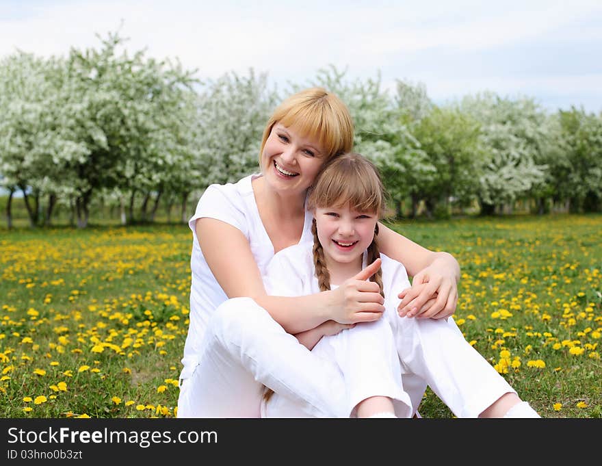 Girl With Mother In Spring Park