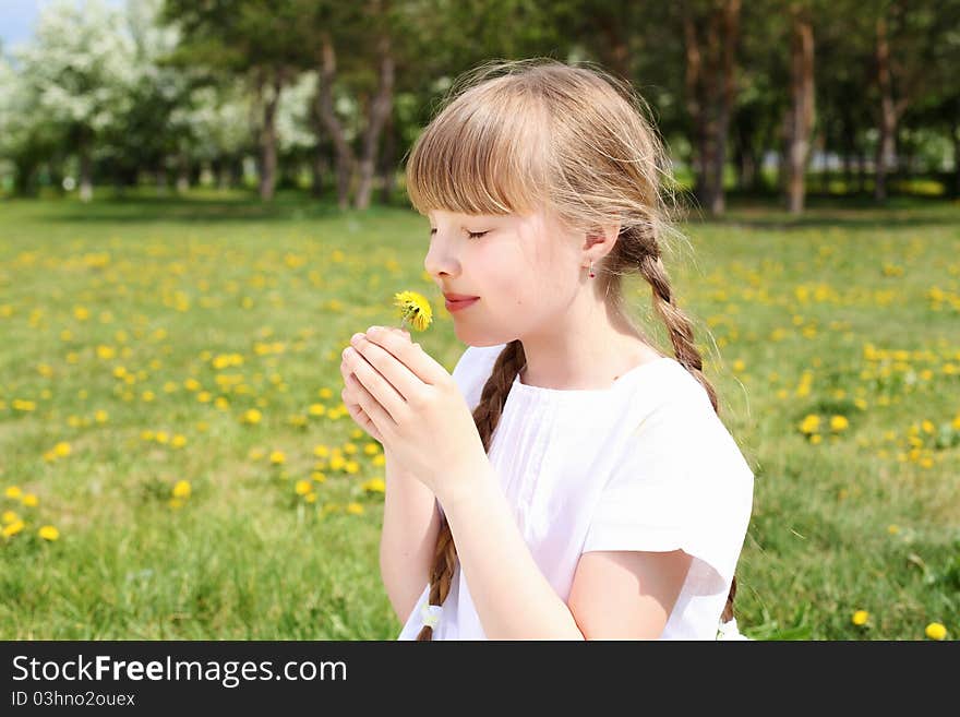 Little girl in white clothes in spring park. Little girl in white clothes in spring park