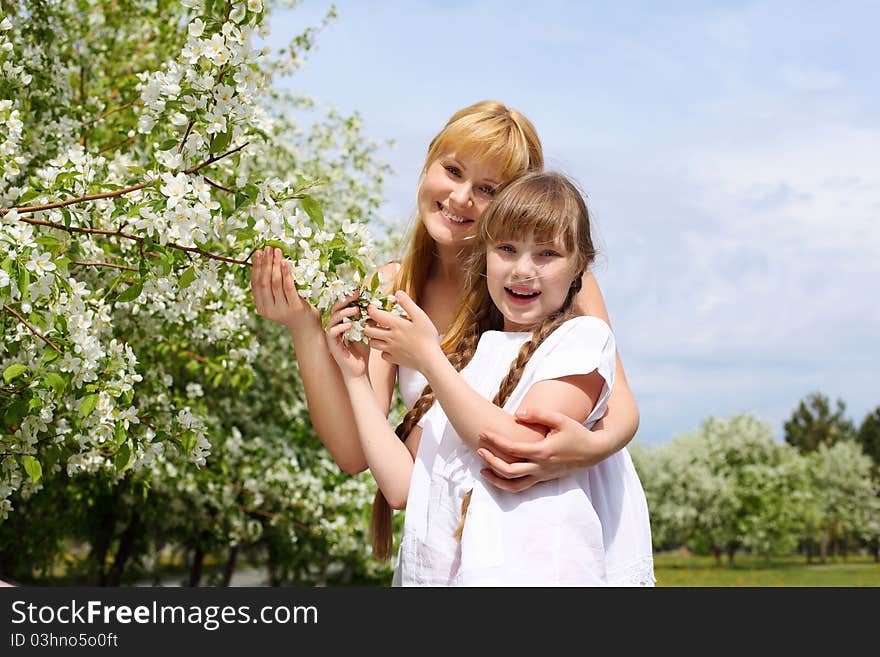 Girl with mother in spring park