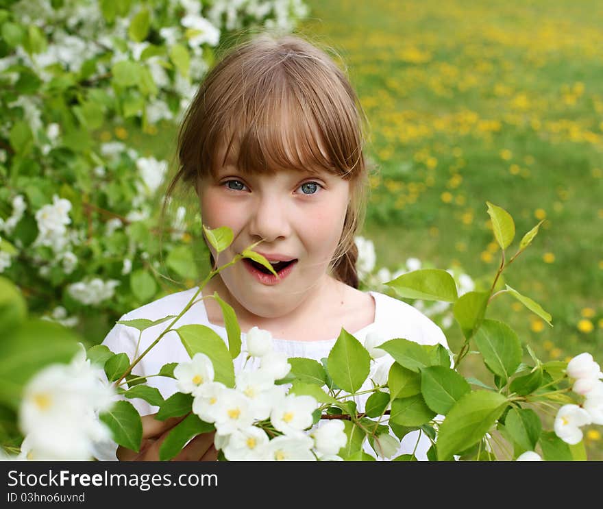 Little girl in white clothes in spring park. Little girl in white clothes in spring park