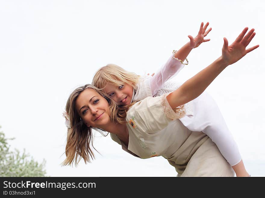 Girl With Mother In The Park